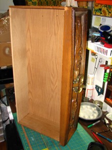 Nasty, plastic front, but decent wooden construction