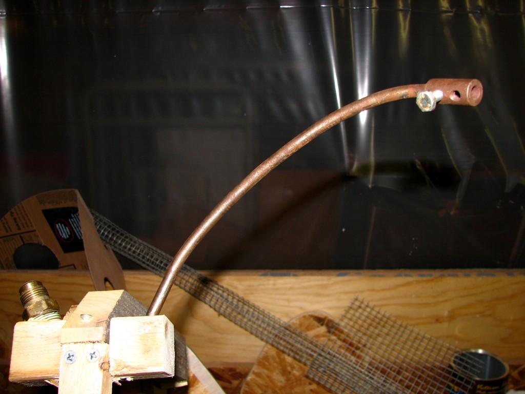 Bent drill bit extender as armature